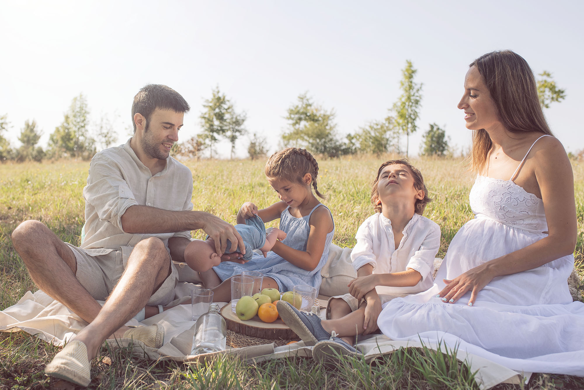 sibling interaction maternity session baby doll activity