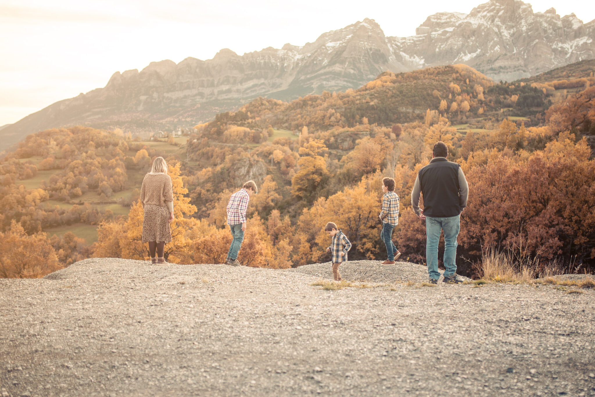 Family walking together in nature during autumn photo session