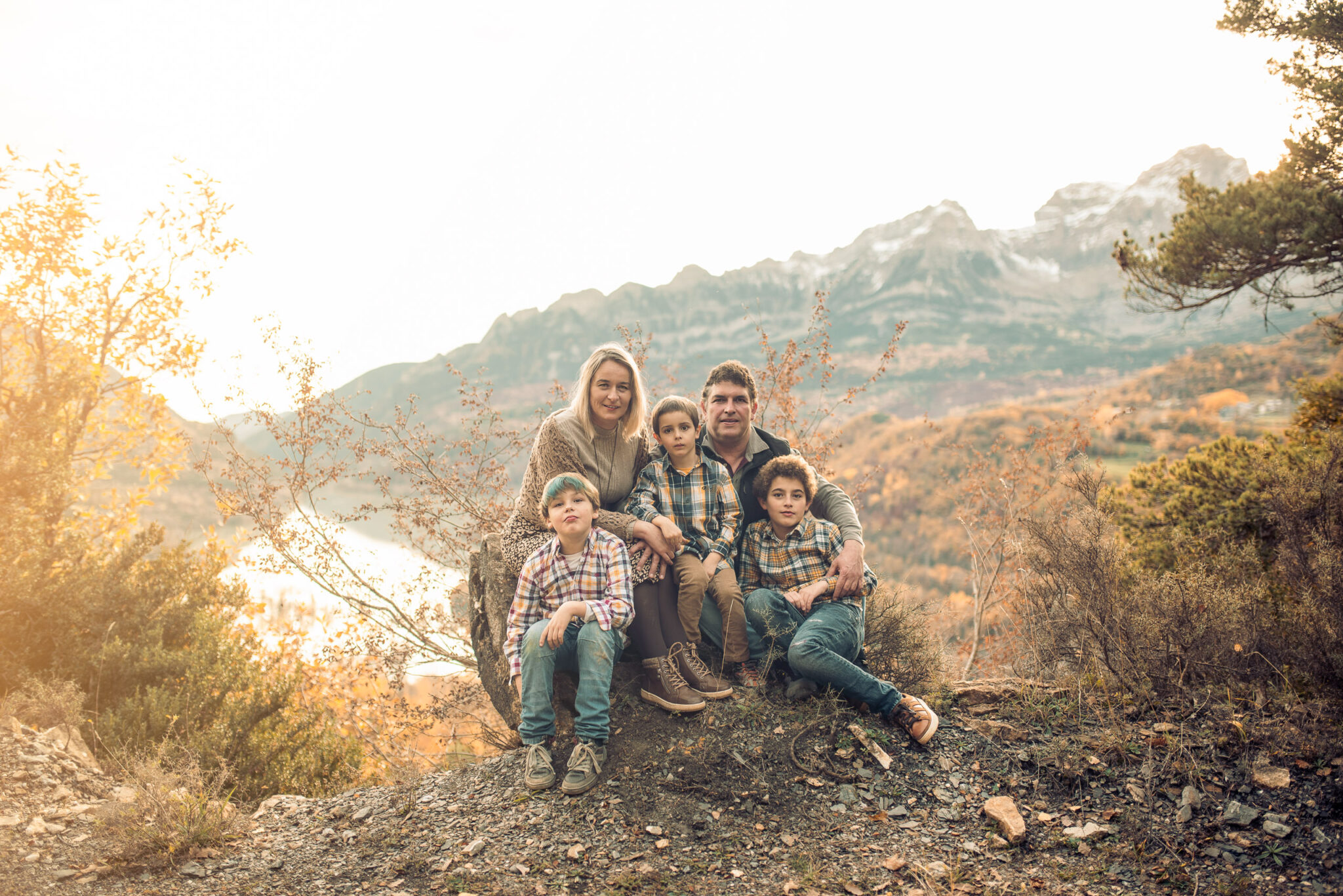 Family portrait outdoors with soft autumn background